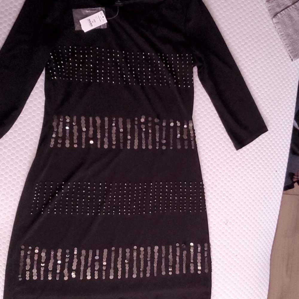 Never worn with tags White House Black Market 3/4 length sleeve black dress